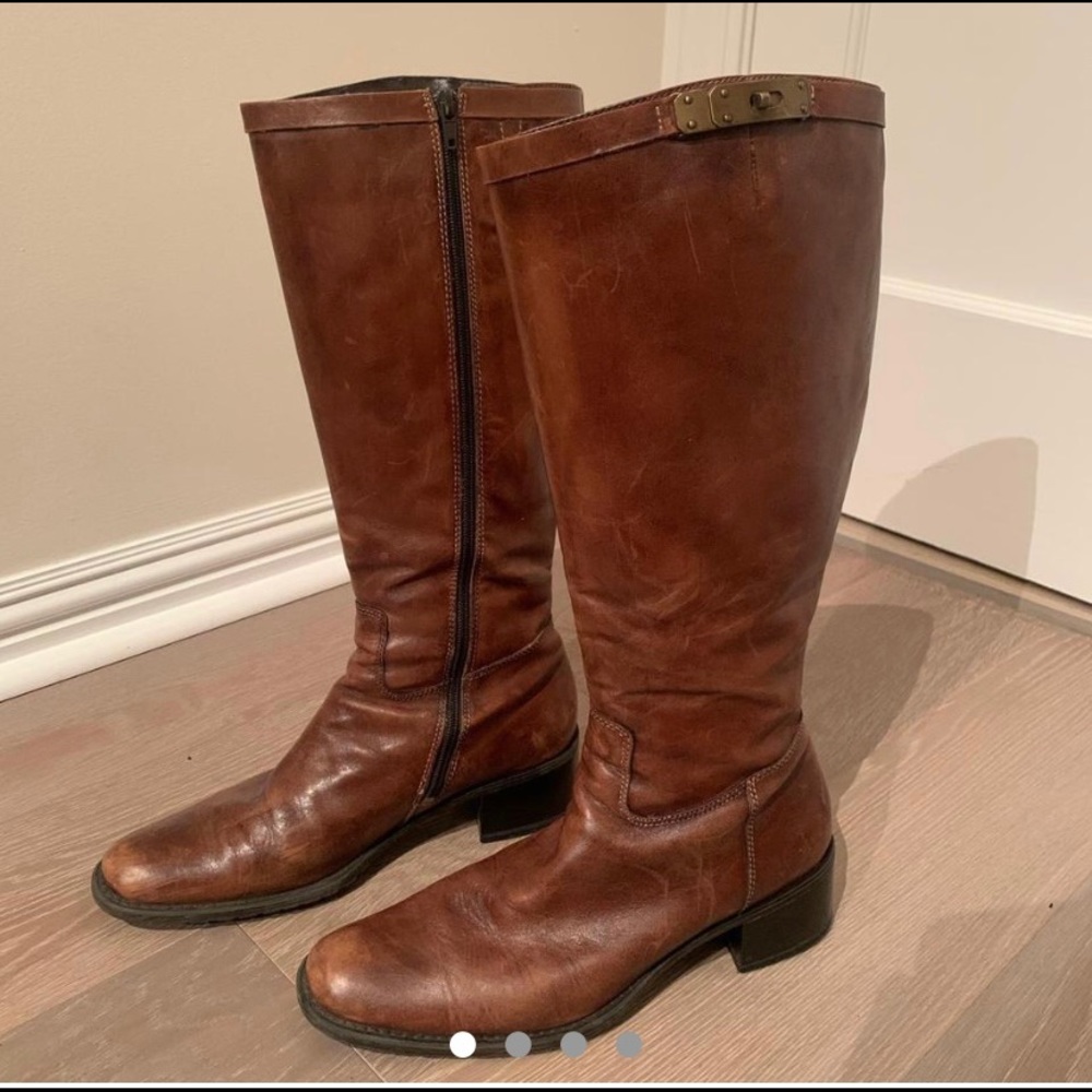 Brown leather boots with brass detailing. Size 8.
